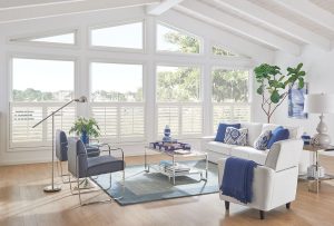 Coastal-style living room with white plantation shutters interior and airy natural light