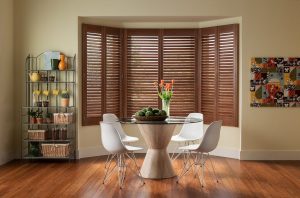Full-length custom interior shutters in modern dining room