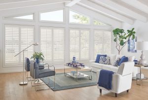 Full-length custom interior shutters in modern living room